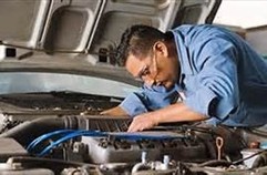 Auto Repair man fixing an engine issue